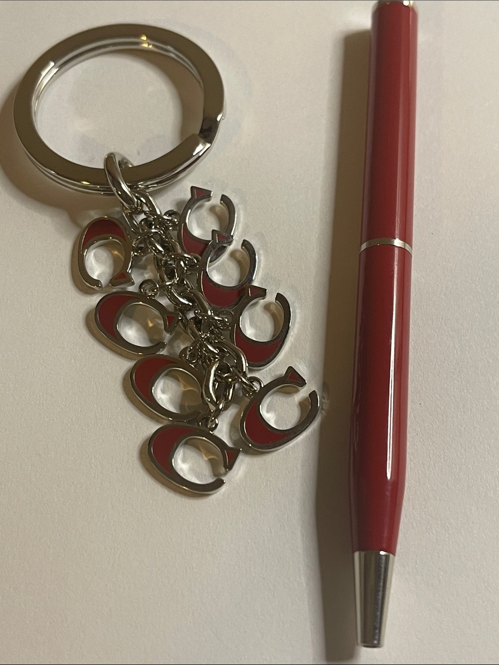 Coach Silver-Tone Keyring with Red Enamel 'C' Charms and Coach Pen